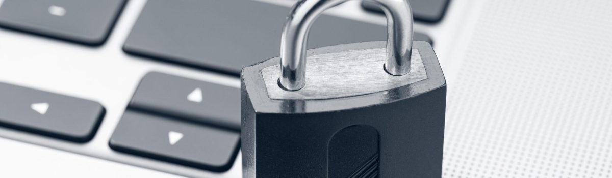 Computer Security, data security protection concept. Closed padlock on modern laptop